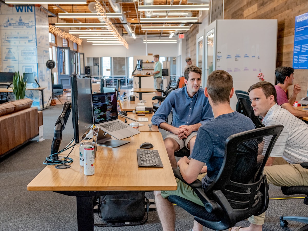 Colleagues working together in an open-plan workplace