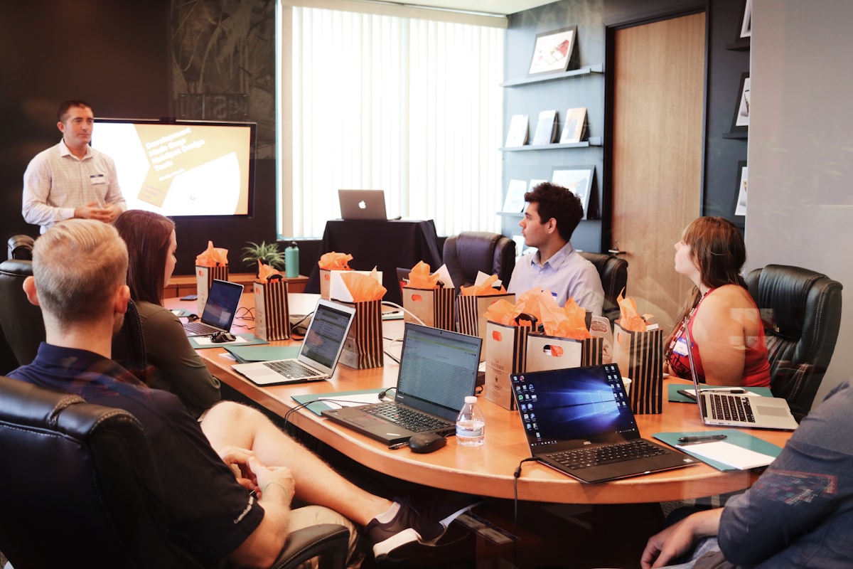 A working session being run for a group around a boardroom table