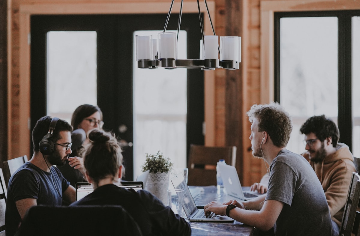 A leadership team working through a discussion around a table